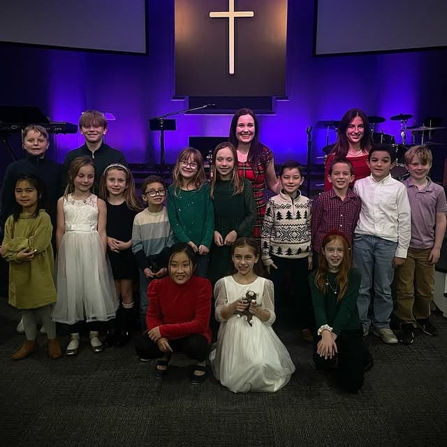 Students gathered on stage at the winter recital